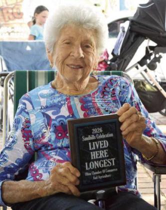 Maddies Hodges received Olton’s “Lived Here the Longest” award at the Recognition of Pioneers and Guests program during the 2026 Olton Sandhills Celebration on Aug. 1. (Photo by Leon Szaniszlo)