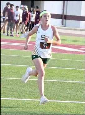 Springlake-Earth senior, Taytum Goodman, blazes to the finish line, taking first place at the Littlefield Invitational on Saturday. (Staff Photo by Derek Lopez)