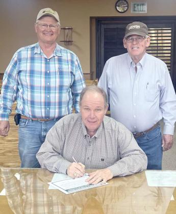 Shown is Lamb County Judge James DeLoach signing a proclamation for Stewardship Week. With Judge DeLoach are (to the Judge’s left) Larry Hobratschk and (to the Judge’s right) Roy Thompson, both are Lamb Co. SWCD Board Directors. (Submitted Photo)