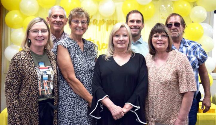 FAMILY VISITORS -- Carrie Barden’s family joined in honoring her on her retirement from the Lamb County Juvenile Probation office, left to right: Dawn Williams, Roger Williams, Tammy Underwood, Carrie Barden, Dan Williams, Jill Barnard, and Vince Barnard. (Photo by Ann Reagan)