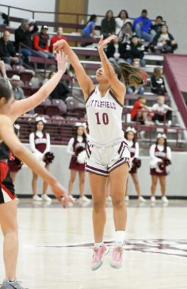 Littlefield senior, Nevaeh Esquibel, banks in a three from the top of the key over a Shallowater defender, during the first half of the Lady Cats’, 56-54, loss to the Fillies at Wildcat Gym. (Staff Photo by Derek Lopez)