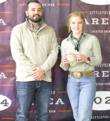 Senior Swine Showmanship Award - Brindle Harper, Littlefield 4-H, with judge Walker Hemphill. (Photo by MD Creations)
