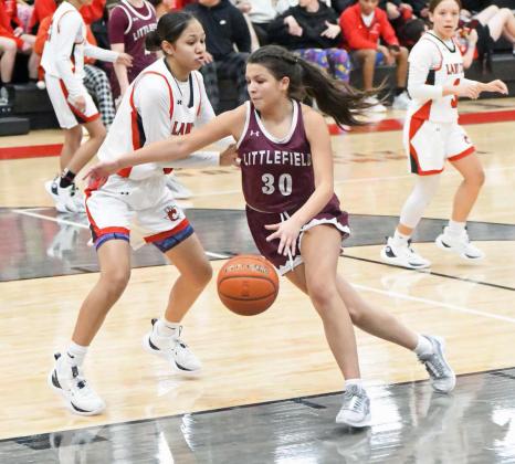 Littlefield forward, Ari Castillo, (30) looks to drive to the basket, during the second half of the Lady Cats’, 76-32, road victory over the Brownfield Lady Cubs on Tuesday in district play. (Staff Photo by Derek Lopez)