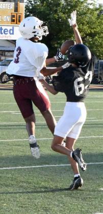 Littlefield’s Jayden Barrio (3), catches a contested pass from Nate Castaneda on Friday for a first down, during the Wildcats’ first scrimmage of the season on the road against Post. (Staff Photo by Derek Lopez)