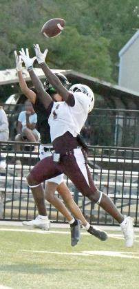 Littlefield’s Eizeah Coleman, catches a touchdown pass from quarterback Chip Green on Friday during the live quarter, during the Wildcats’ first scrimmage of the season on the road against Post. (Staff Photo by Derek Lopez)