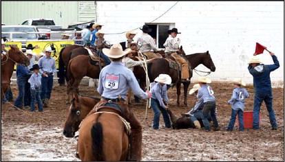 These fierce young competitors are not allowing a little mud to interfere with their branding competition at the Junior WCRA Rodeo in Earth.