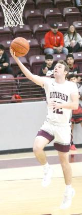 Littlefield junior, Chip Green, gets out on the break and drops in an easy lay-up, during the first half of the Wildcats’, 72-34, victory over the Lobos at Wildcat Gym on Tuesday in non-district play. (Staff Photo by Derekl Lopez)