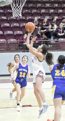 Littlefield’s Ari Castillo (30) drives to the basket for a lay-up, during the first half of the Lady Cats’ Wildcat Classic victory over Hale Center last Thursday. (Staff Photo by Derek Lopez)