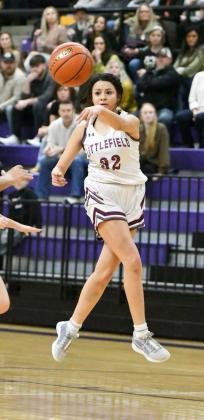 Littlefield senior, Jasmine Castillo, drives the left side of the basket and kicks the ball across the lane to Amiah Elizondo for a lay-up, during the first half of the Lady Cats’Area round loss to Canadian on Friday at Canyon High School. (Staff Photo by Derek Lopez)