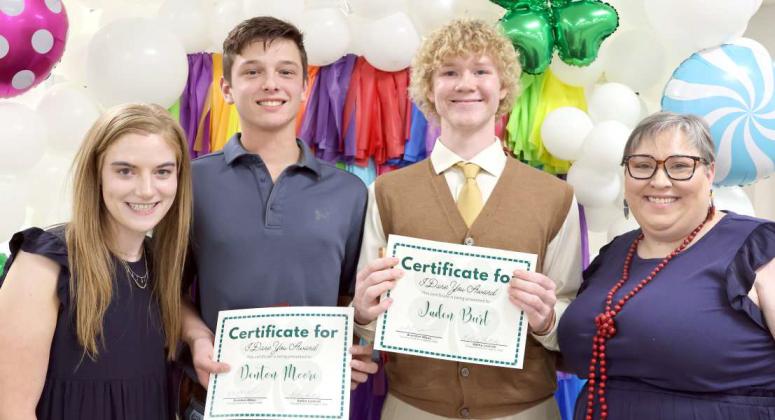 Brindle Harper, left, and Kathy Lostroh far right, of the Lamb County Extension Office congratulate the recipients of the “I Dare You Award”, Denton Moore and Jaden Burt at the Lamb County 4-H Banquet held at the Lamb County Ag Center on Saturday, August 17, 2024. (Photo by Ann Reagan)