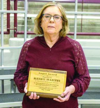 Renee Martin receives the Littlefield Angel Award and a $5,000 donation at the High School academic awards ceremony. (Photo by Madison Vidales)