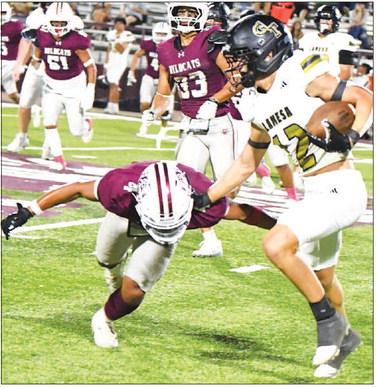 Littlefield’s Brandon Espinoza (4) makes an open-field tackle, during the