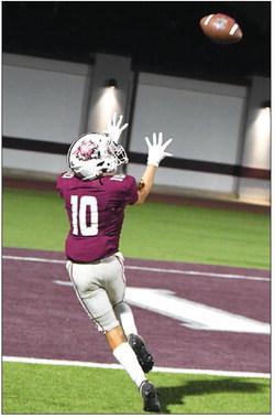 Littlefield’s Nehemiah Beanes catches his first touchdown pass of the season from quarterback Sammy Saenz, during the Wildcats’, 60-6, victory in their home-opener over Lamesa last Friday at Wildcat Stadium. (Staff Photo by Derek Lopez)