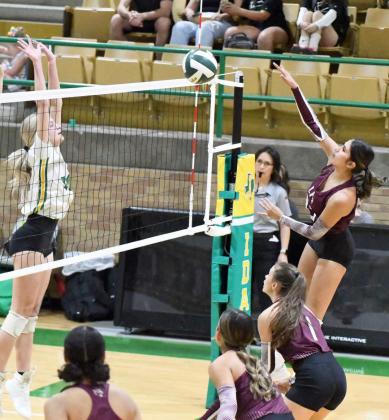 Littlefield’s Nevaeh Lopez goes up to deliver a kill past the Idalou blocker, during the Lady Cat’s first set against Idalou on the road on Saturday in their district-opener. (Staff Photo by Derek Lopez)