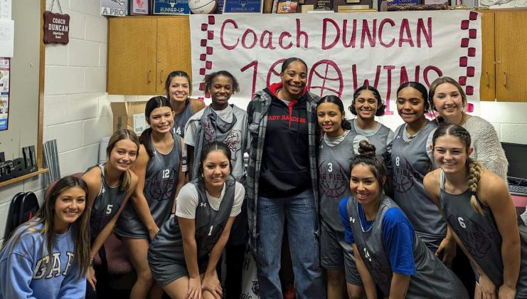 Littlefield Lady Cats’ Head Basketball Coach Teddy Duncan earned her 100th career win as a coach last Tuesday when the Lady Cats defeated the Hale Center Lady Owls for their first win of the season. Shown is Coach Duncan with her team. (Submitted Photo)