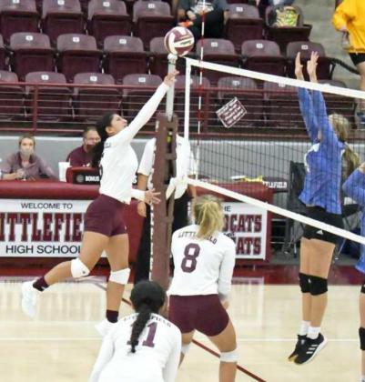 OVER THE BLOCKER – Littlefield’s Ellie Lopez (5) tips a ball over the Olton Blocker, looking to score a point for the Lady Cats, during their match on Saturday at Wildcat Gym. The Lady Cats defeated the Fillies in straight sets, 3-0. (Staff Photo by Derek Lopez)