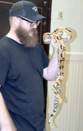 Jarrod Dale of Walter’s World of Pets in Lubbock, brought a few friends to the Summer Reading Program at the Lamb County Library. Mr. Dale is pictured with a pet Colombian Boa Constrictor. (Photo by Ann Reagan)