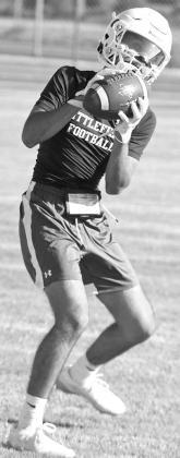 The Littlefield Wildcat, Gabe Mata catches a pass, during the first day of two-a-days on Monday morning. (Staff Photo by Derek Lopez)