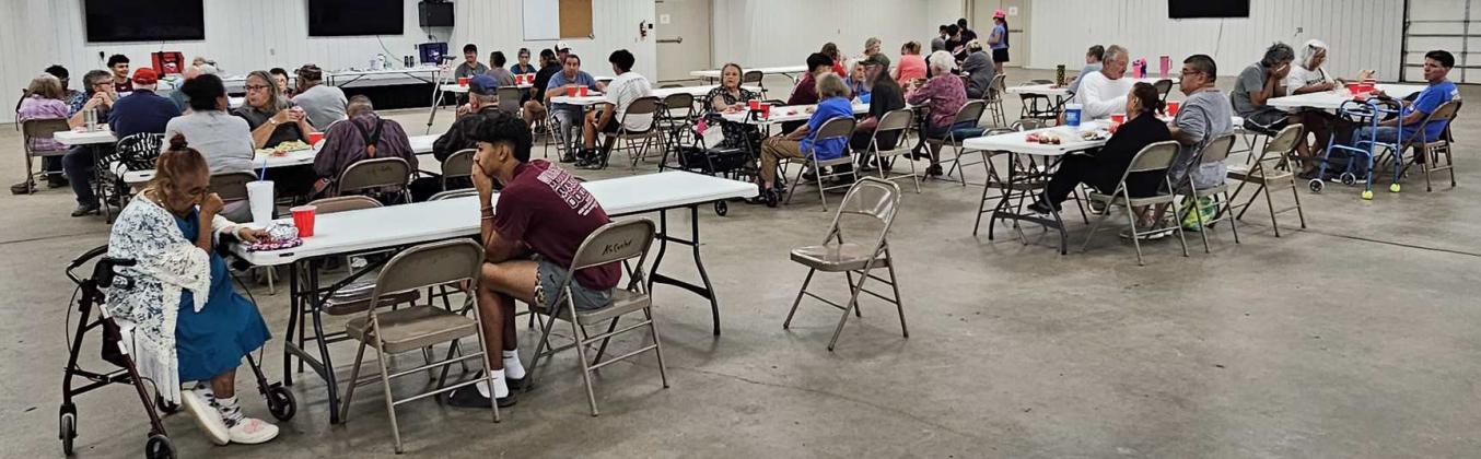 Members of the Littlefield varsity football team mingle with the folks in attendance at the Sisters of Hope and Grace luncheon at the Lamb County Ag Center on Saturday. (Staff Photo by Derek Lopez)