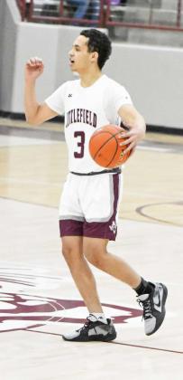 Littlefield senior, Ryan Williams (3), calls out the offense as he brings the ball down the floor, during the first half of the Wildcats loss to the Tigers on Tuesday at Wildcat Gym. (Staff Photo by Derek Lopez)
