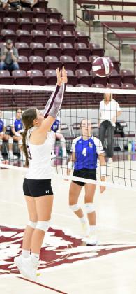 Littlefield’s Maggie McNeese goes up for a block, during their first set against Lubbock Christian on Tuesday at Wildcat Gym. (Staff Photo by Derek Lopez)