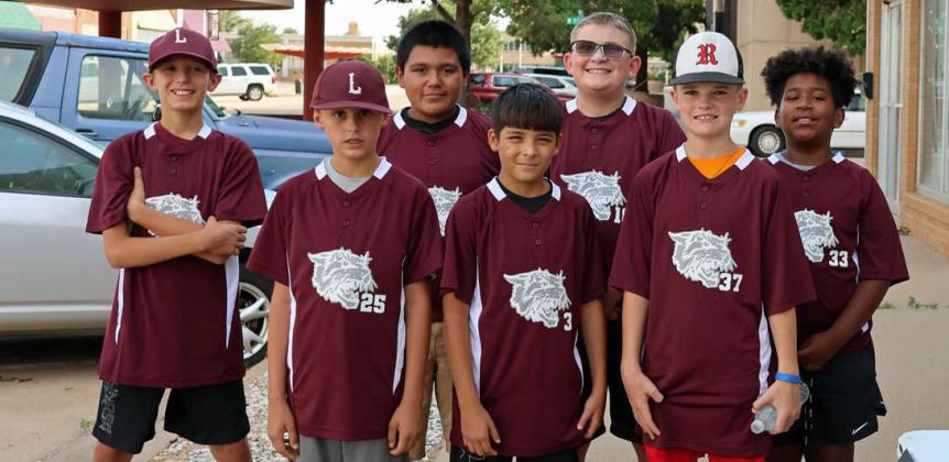 Littlefield 12U baseball players held a car smash on Friday evening to try and help raise money for their upcoming travel ball season. (Top Photo) shows Easton Yesel laying into the vehicle with a sledge hammer. (Bottom Photo Shown): Brody Bussanmas, Antonio Garcia, Dylan Adkins, Levi Weaver, Beau Bussanmas, Isaias Cedillo and Easton Yesel. (Photos by Ann Reagan)