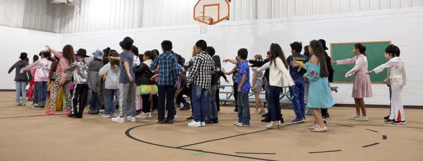 Third graders of Littlefield Elementary perform a dance routine from Michael Jackson’s “Thriller”. (Photo by Ann Reagan)