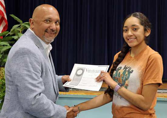 Principal Jose Gonzales of the Amherst ISD presented the South Plains College Award to Dennys Reyes, Valedictorian of the Amherst Senior Class at the Awards Ceremony held on Monday, May 13, 2024. (Photo by Ann Reagan)