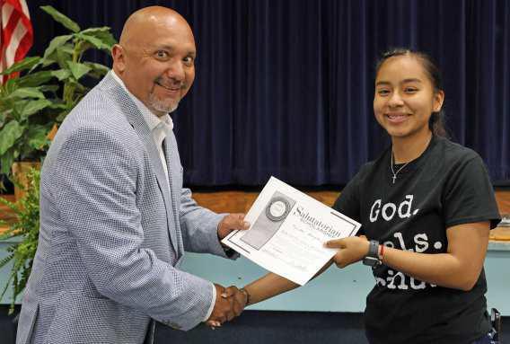 Principal Jose Gonzales, Principal of the Amherst ISD presented the South Plains College Award to Salutatorian. Maricella Gonzalez, of the Amherst Senior Class at the Awards Ceremony held on Monday, May 13, 2024. (Photo by Ann Reagan)