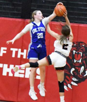 Olton’s Analise Ramage blocks a shot in the paint, during the first half of the Fillies’ Whitharral Invitational Championship victory over the Lady Panthers on Saturday. (Staff Photo by Derek Lopez)