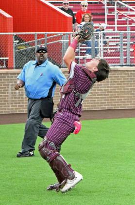 Littlefield’s Jayden Kirkland catches a pop up behind the plate for the second out in the bottom of the second inning of game one of the Wildcats’ Class 3A Area Play-off series on Thursday at Lubbock-Cooper High School. (Staff Photo by Derek Lopez)