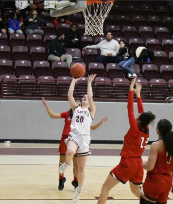 GETTING TO THE RIM – Littlefield sophomore, Kennadi Hanlin (20), gets to the basket for a lay-up, during the first half of the Lady Cats, 58-20, loss to the Lady Cubs on Friday at Wildcat Gym. (Staff Photo by Derek Lopez)