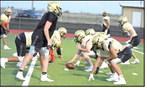 Sudan works on their offense during their intersquad scrimmage Saturday night at Hornet Stadium. (Staff Photo by Derek Lopez)