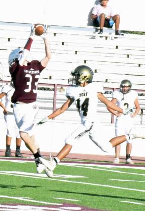 CATCH AND RUN – Littlefield’s Brayden Redman (33) catches a pass from quarterback Nate Castaneda over the Post defense for a huge gain, during the Wildcats’, 36-18, victory over Post at Wildcat Stadium on Thursday. (Staff Photo by Derek Lopez)
