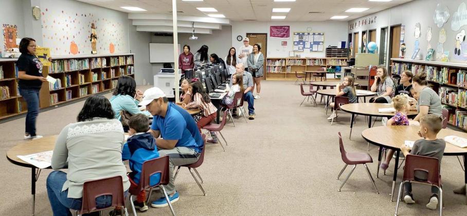 Pre-K students and their parents participate in the Read Aloud Station of the first Family Reading Night hosted by Littlefield Primary School on Monday. (Submitted Photo)