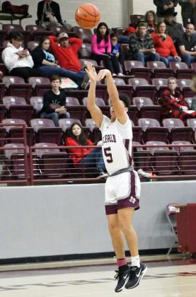 Littlefield senior, Jeremiah Trevino, pulls up for a jumper from the right elbow, during the first half of the Wildcats’ victory over Friona on senior night on Friday at Wildcat Gym. (Staff Photo by Derek Lopez)