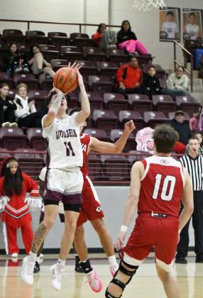 Littlefield senior, Josiah Garcia, puts up a short jumper on the right baseline, during the first half of the Wildcats’ victory over Friona on senior night on Friday at Wildcat Gym. (Staff Photo by Derek Lopez)
