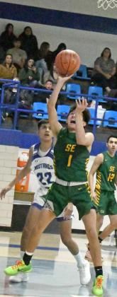 GOING UP STRONG – Springlake-Earth’s Evan DeLeon (1), goes up strong to the basket for a lay-up, during the first half of the Wolverine’s loss to the Mustangs on Tuesday at Mustang Gym. (Staff Photo by Derek Lopez)