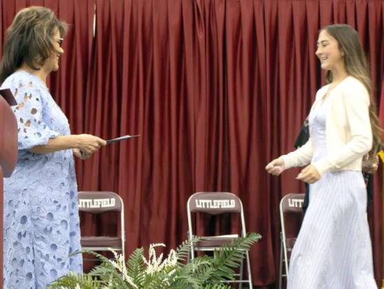 Teagan Miller receives the Lamb County Electric Cooperative Scholarship at the Littlefield High School Scholarship Awards Ceremony on May 20, 2025. Miller additionally received the $1,000 First Federal Bank Scholarship, Delta Gamma Gamma Iota Chapter Scholarship and the Littlefield Arts and Heritage Scholarship. (Photo by Madison Vidales)