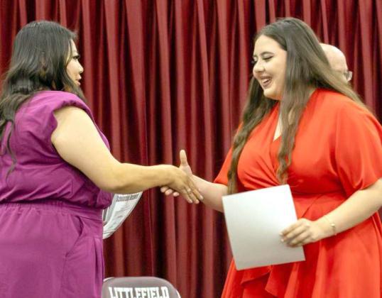 Alice Ordonez receives her $250 band scholarship at the Littlefield High School Scholarship Awards Ceremony on May 20, 2025. (Photo by Madison Vidales)