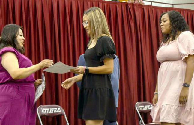 Myli Hernandez and Kiya Williams receive their band scholarships at the Littlefield High School Scholarship Awards Ceremony on May 20, 2025. (Photo by Madison Vidales)