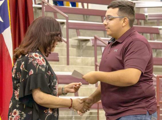Sean Ybarra receives the Littlefield Classroom Teachers Association scholarship at the Littlefield High School Scholarship Awards Ceremony on May 20, 2025. Ybarra additionally received the $500 Littlefield Elementary Scholarship, the Littlefield Ex-Students Association Scholarship and the South Plains College Founders Challenge $1,000 Scholarship. (Photo by Madison Vidales)