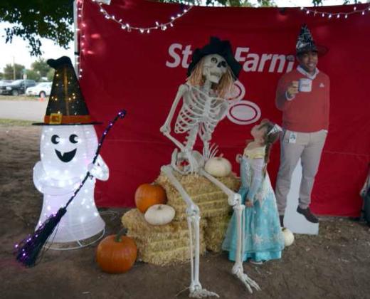 Gianna helps the very skinny guy in the photo booth recover his left eyeball as “Jake from State Farm looks on.
