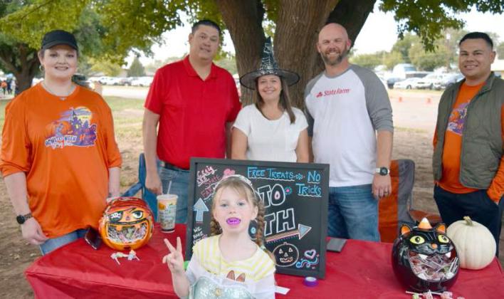 (Below) Lauren VanZanot, Brandi Lee, Chon Portillo, Crag Lee, Ricky Aleman, with Gianna Ferrumpou out in front. The crew of State Farm Insurance of Littlefield were on hand to pass out goodies and man the photo booth at the Pumpkin Trail in Crescent Park on Saturday, October 21, 2023. (All Photos by Ann Reagan)