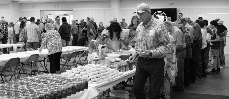 Attendees go through the line to plate their meal, during the annual Texas Producers Co-op annual event on April 28th. (Photo by Eric Venkatesan)