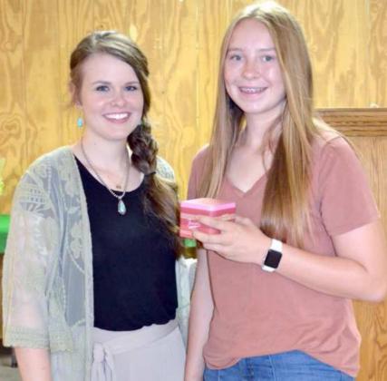 GOLD STAR AWARD–-The highest award given throughout the state of Texas to outstanding 4-H members in each county, were awarded to two of Lamb County’s Senior 4-H members: Taryn Golden, right, Lamb County 4-H member, and (not shown) Dell Smith, of the Sudan 4-H Club, were presented this top award Saturday evening. Shown with her is Extension Agent Kendra Callahan. (Staff Photo by Joella Lovvorn)