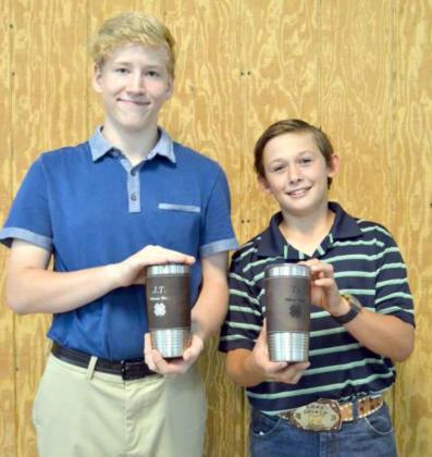 SILVER STAR AWARDS – JT Burt and Ty Carr, hold their Silver Star Awards. The Silver Star Award is a highly coveted award that 4-H members in the sixth thru eighth grades can receive. They must have accomplished many 4-H projects, participated in many activities, and go through an interiew process with two judges. (Staff Photo by Joella Lovvorn)