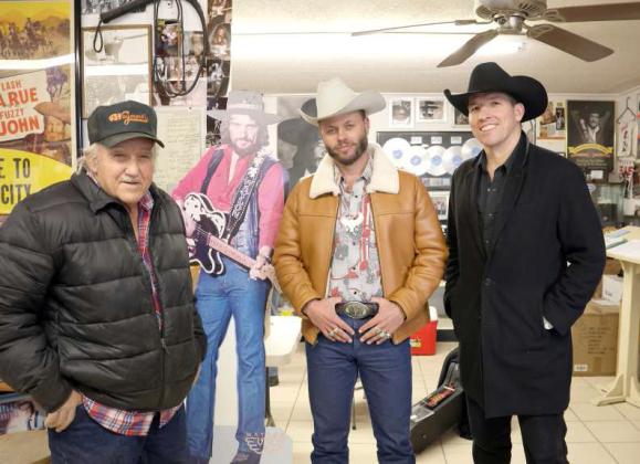 Left to right- James Jennings, Charley Crockett, and Dallas Burrow have a little fun being photographed with the stand up of the legendary Waylon Jennings at Waymores of Littlefield, Tx on January 8, 2024.