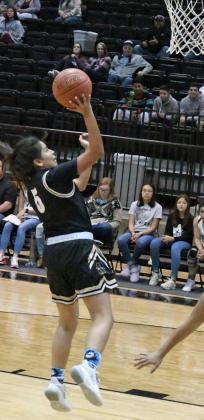 UP FOR TWO — Sudan junior, Liz Sital (5), gets down the court and puts up a lay-up in transition, during the first half of the Nettes’, 50-28, victory over the Muleshoe Lady Mules on the road on Monday. (Staff Photo by Derek Lopez)