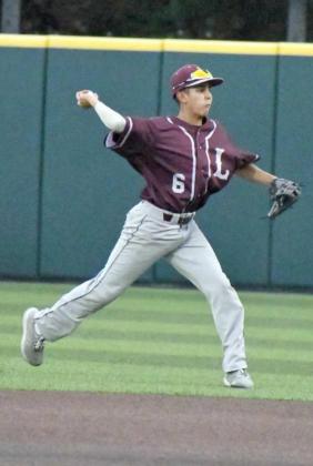 OUT AT FIRST – Littlefield second baseman, Jeremiah Salazar, fields a ball in the grass at second base and throws it to first for the out, during game one of the Wildcats’ Class 3A Regional Semi-Final Series with Brock on Thursday. (Staff Photo by Derek Lopez)